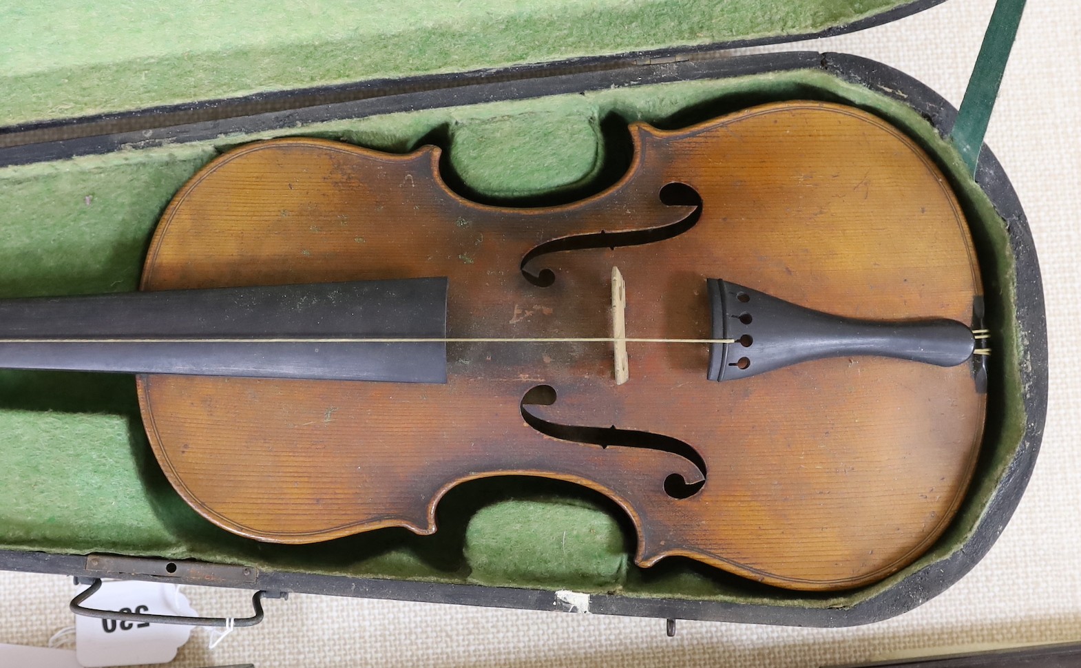 A cased German violin, 60cms long